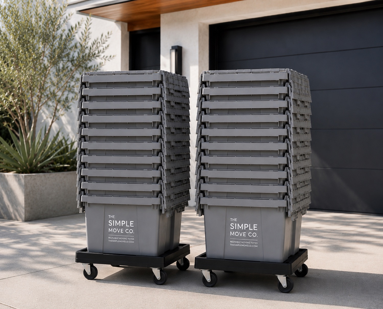 Branded reusable moving totes stacked on wheeled dollies, ready for delivery
